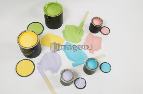 Open paint cans, lids, colour swatch and stir sticks, Canada, British Columbia