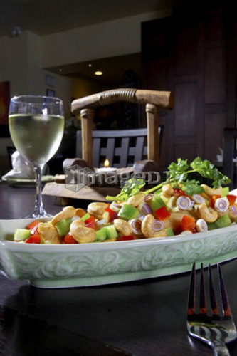 Cashew chicken dish paired with white wine
