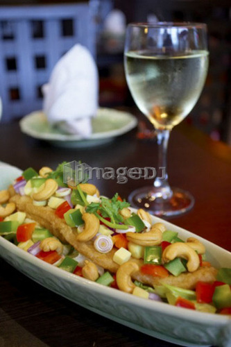 Cashew chicken dish paired with white wine