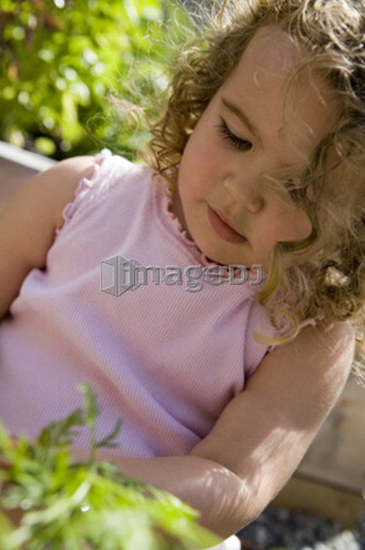 Child (female 2.5 years) in the garden, North Vancouver, BC