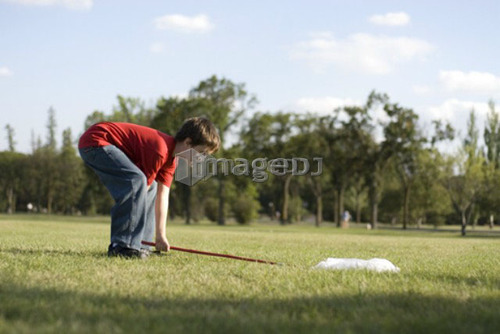 Six year old boy with butterfly net in park, Assiniboine Park, Winnipeg, Canada