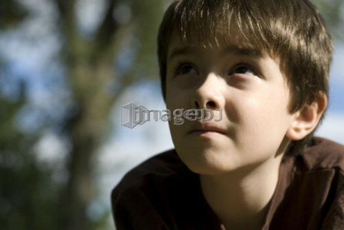 Six year old boy looking upward, Winnipeg, Canada