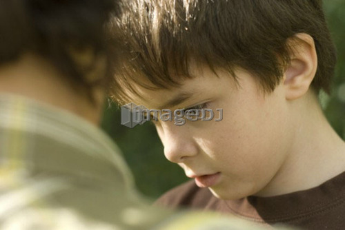 Six year old boy looking intent, Winnipeg, Canada