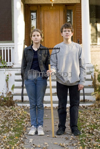 Teen brother and sister in American Gothic pose, Winnipeg, Canada