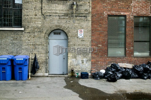 Garbage and recycling in a back alley, Toronto, Ontario, Canada
