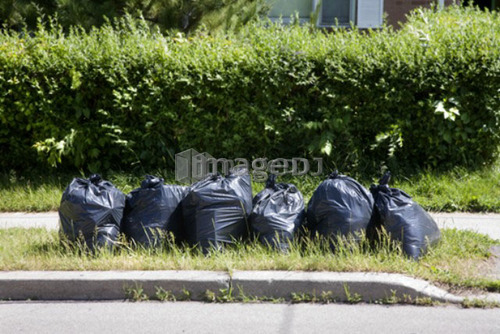 6 garbage bags put out  for collection, Toronto, Ontario, Canada