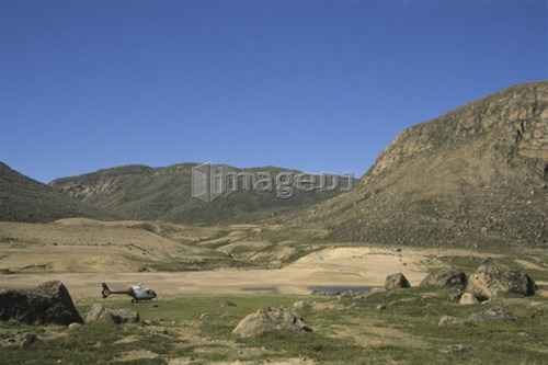 Helicopter rests near Qaungnat Lake, Ukkusiksalik National Park, Wager Bay, Nunavut, Canada
