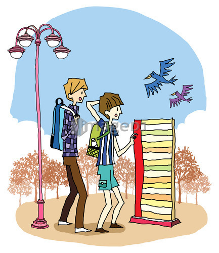 Side view of boy and girl standing by streetlight