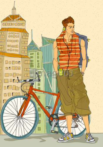 Young man standing by bicycle