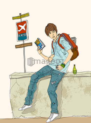 Teenage boy sitting on bus stop