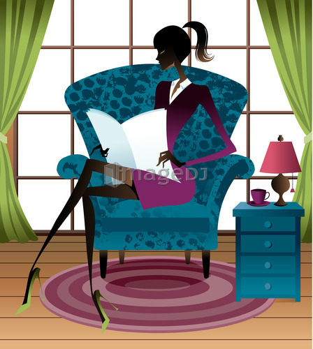 Young woman sitting on sofa holding files