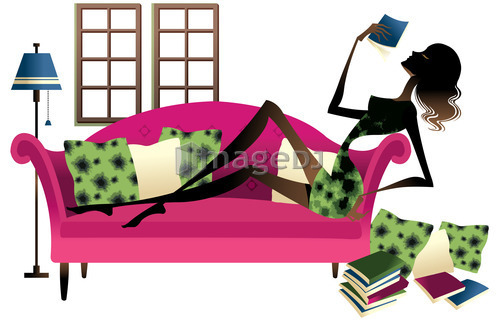 Woman lying on couch, reading book