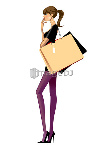 Side view of Young woman standing with shopping bags