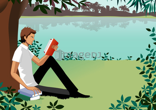 Man sitting under tree, reading book