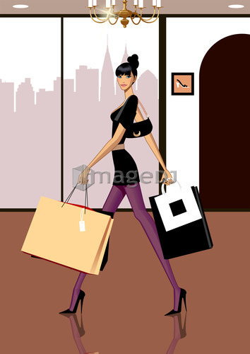 Portrait of Young woman carrying shopping bags