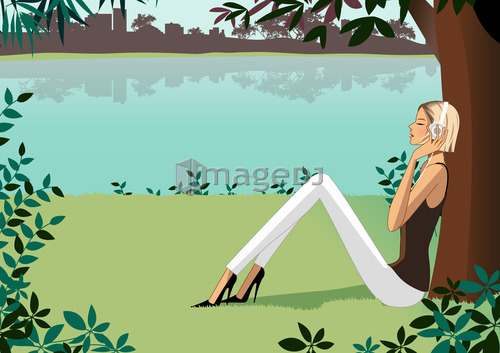 Woman sitting under tree, listening music