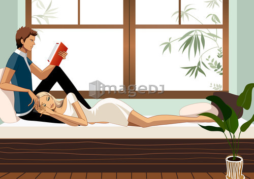 Man reading and woman sleeping on bed