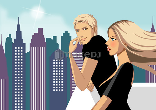 Side view of couple standing, skyscraper in background