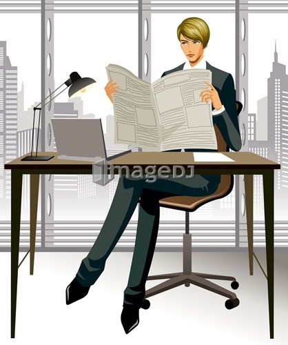  Businessman reading a newspaper in office