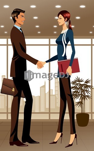 Two business people shaking hands in office