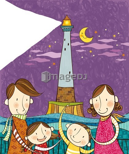 Portrait of happy family in front of lighthouse