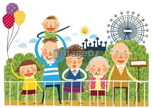 Portrait of large family in front of amusement park