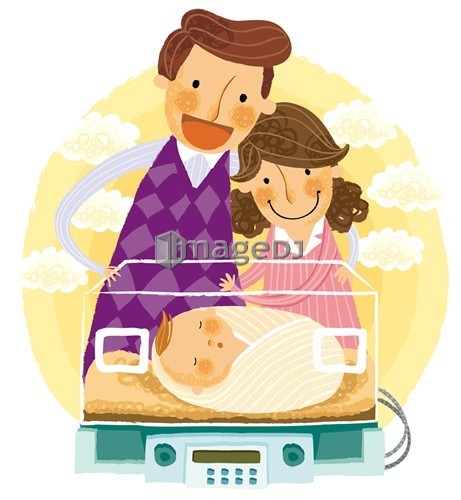 Parents looking at newborn baby in an incubator